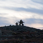 Sunset at the Ulu Camp. Inuksuit erected above the Flood Zone surface trace